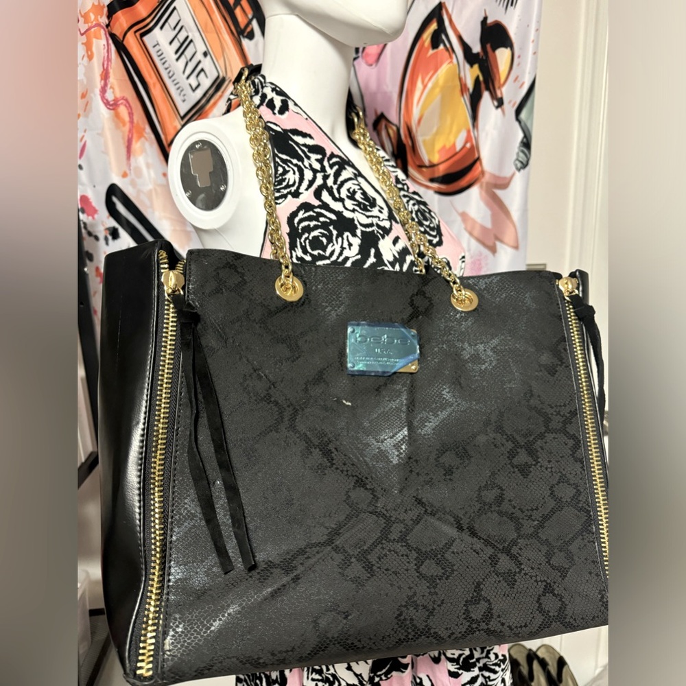 Like new Bebe black snack print tote/ shoulder bag with gold chain straps